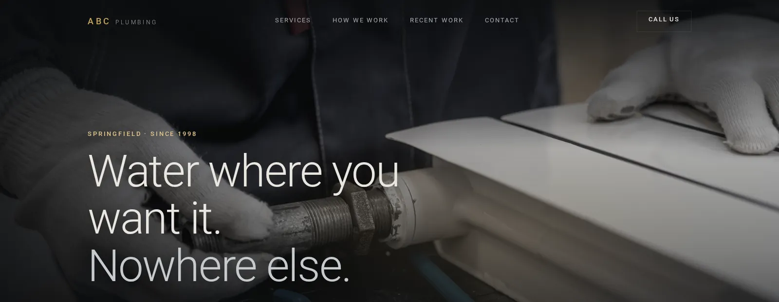 Concept homepage in a dark theme: a photograph of gloved hands fitting a pipe, with the city and founding year set above the headline.